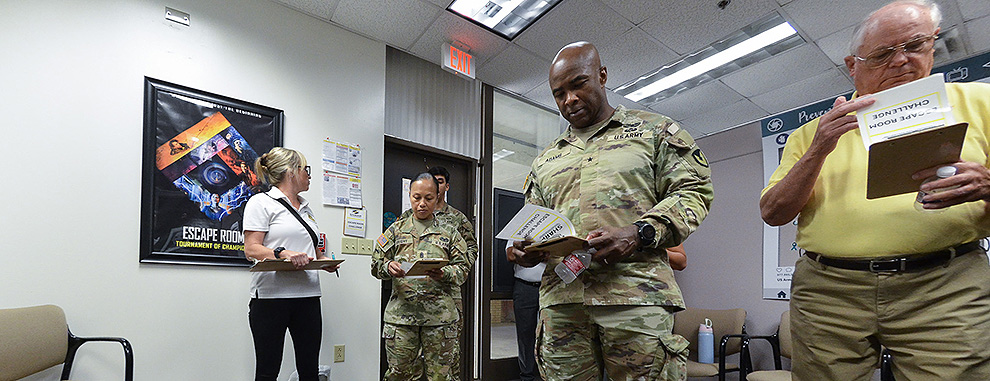 MICC command team accepts SHARP Room Challenge